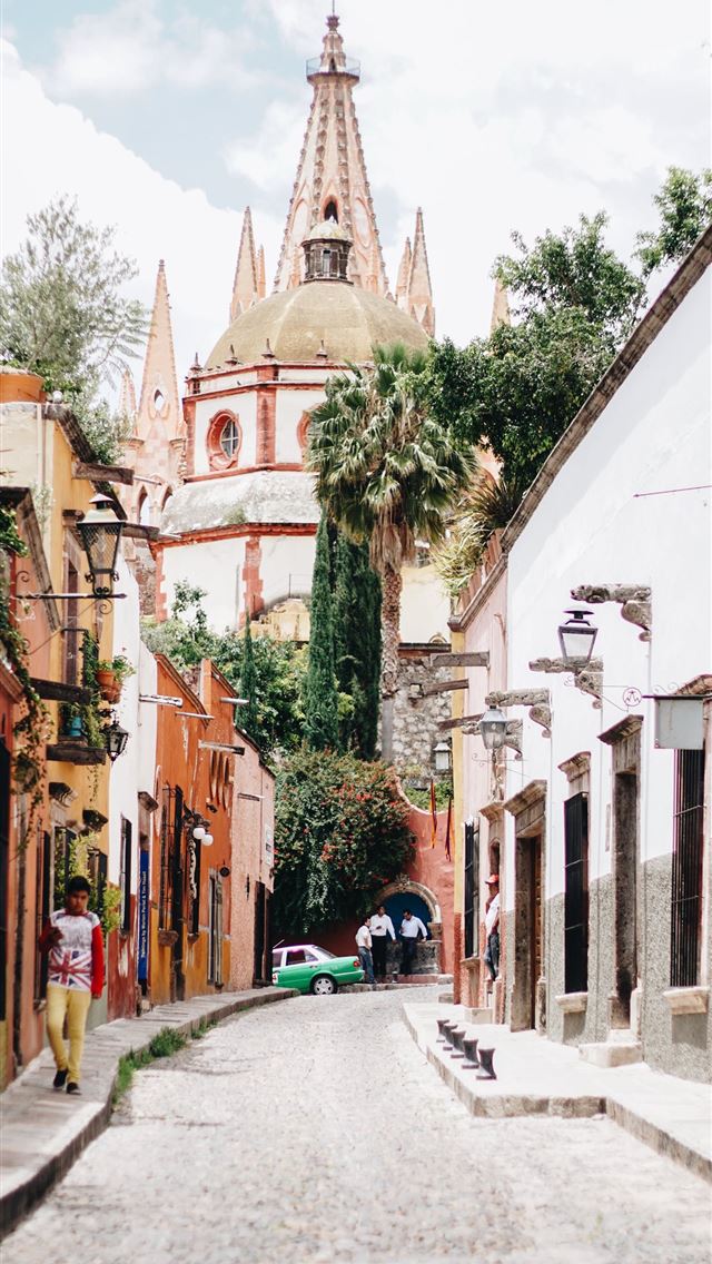 1284x2778 narrow road heading toward church - mexico iPhone Wallpaper