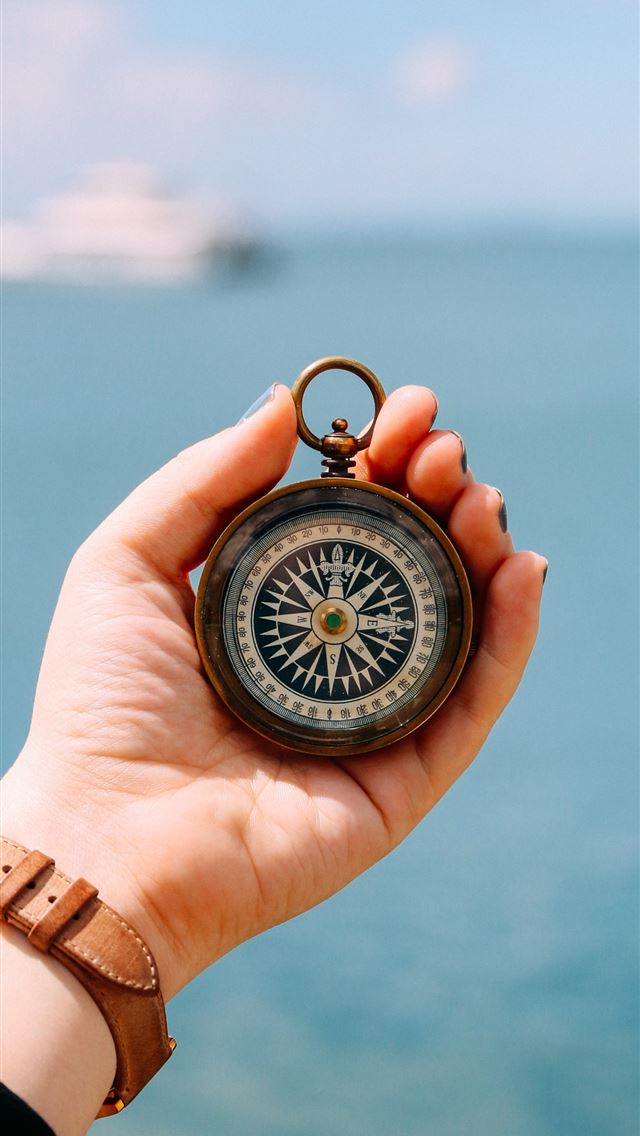 640x1136 person holding compass -  iPhone Wallpaper