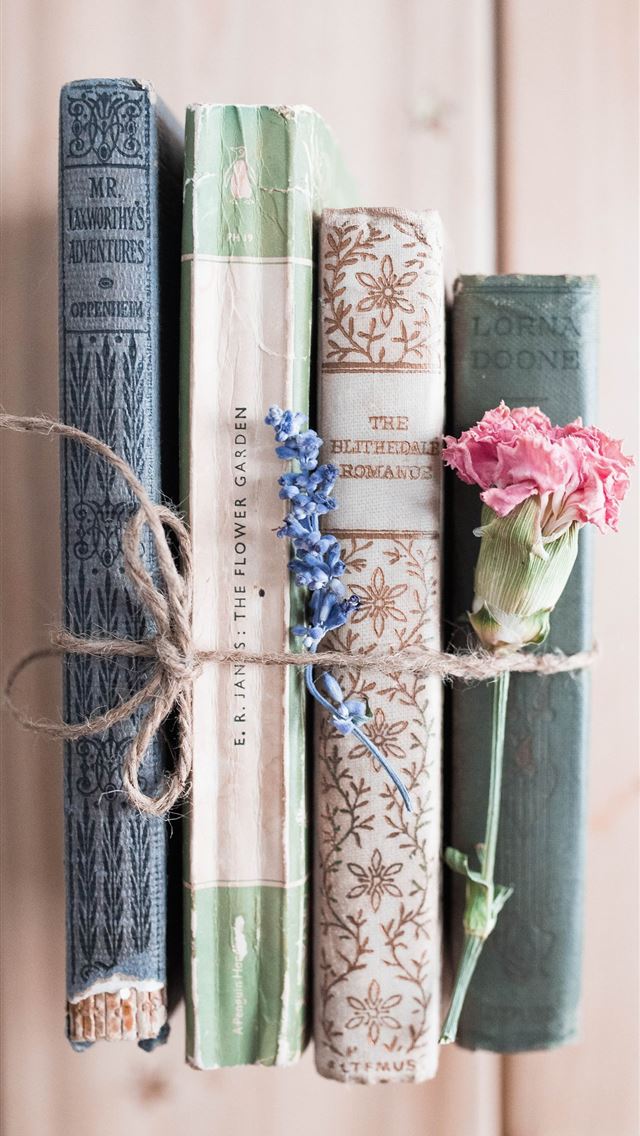 1284x2778 four assorted title books - vintage iPhone Wallpaper