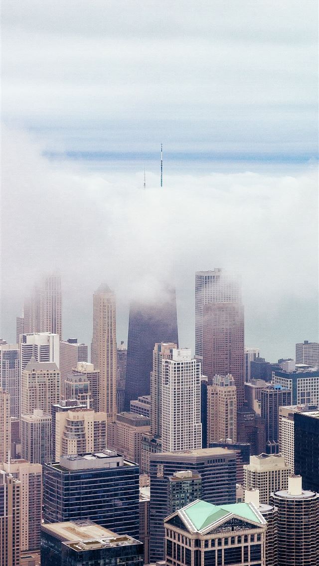 1284x2778 skyscrapers under cloudy sky - clouds iPhone Wallpaper