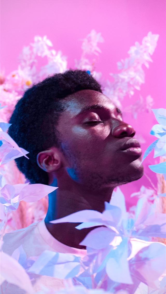 1284x2778 woman's face surrounded by white petaled flowers - purple iPhone Wallpaper