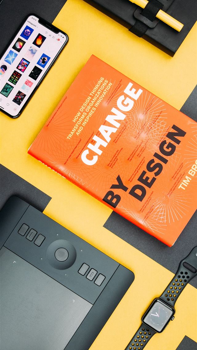 1284x2778 Change by Design by Tim Brown book beside smartpho... -  iphone 13 Wallpaper
