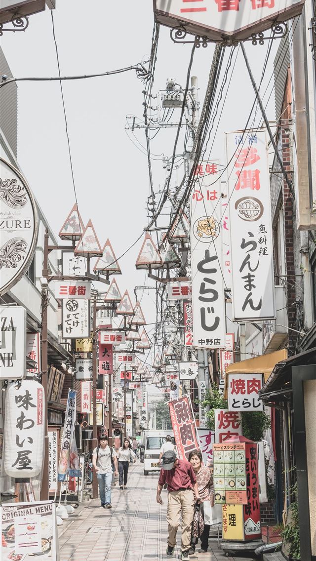 1284x2778 people walking near posts - japan iPhone Wallpaper