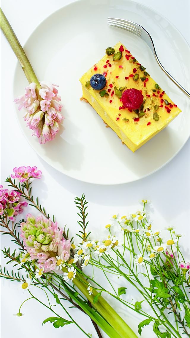 1284x2778 round white plate beside flowers - cake iPhone Wallpaper