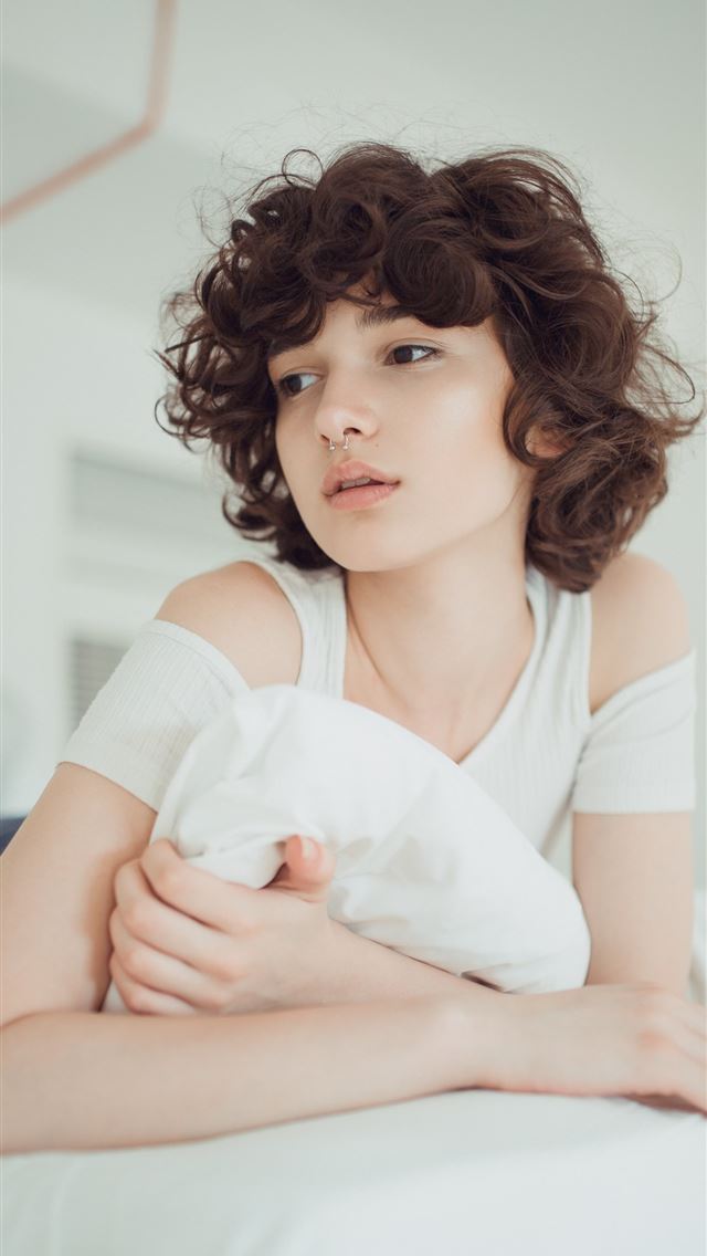 1284x2778 woman in white shirt lying on bed - girl iPhone Wallpaper