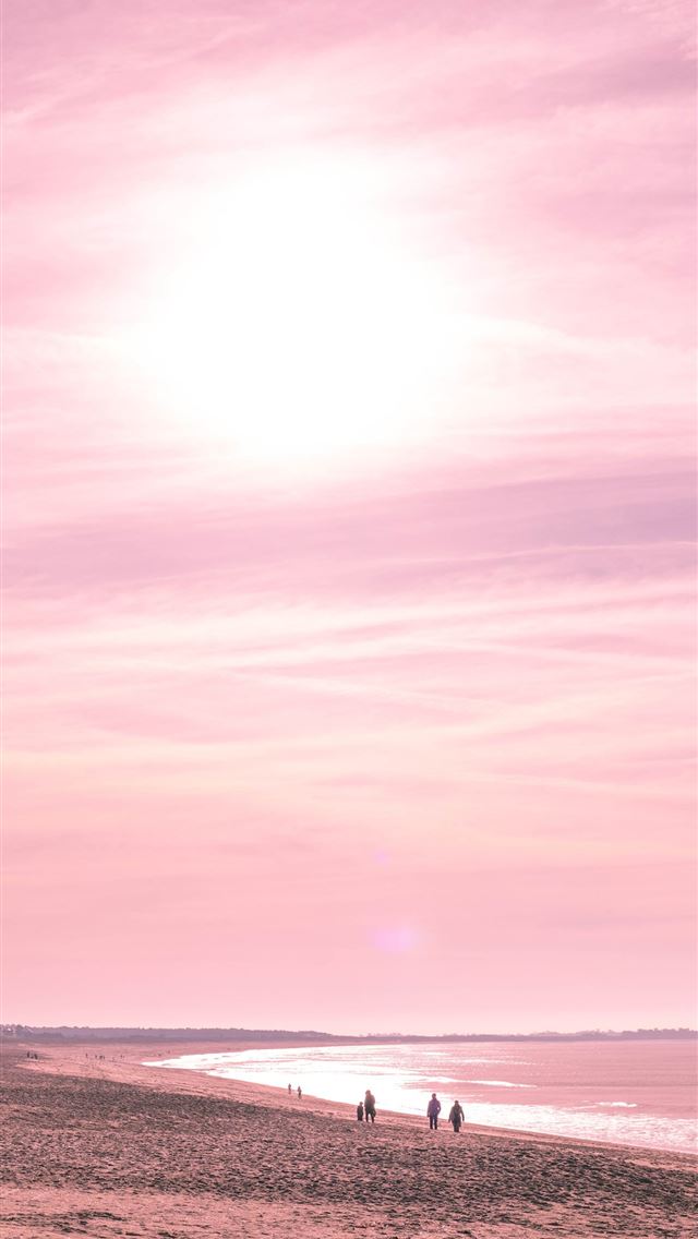 1284x2778 people walking along seashore during golden hour - france iPhone Wallpaper