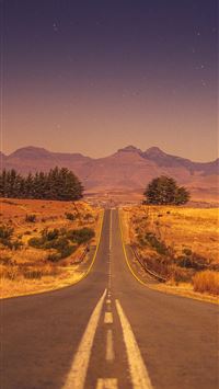 view of a long empty road wallpaper