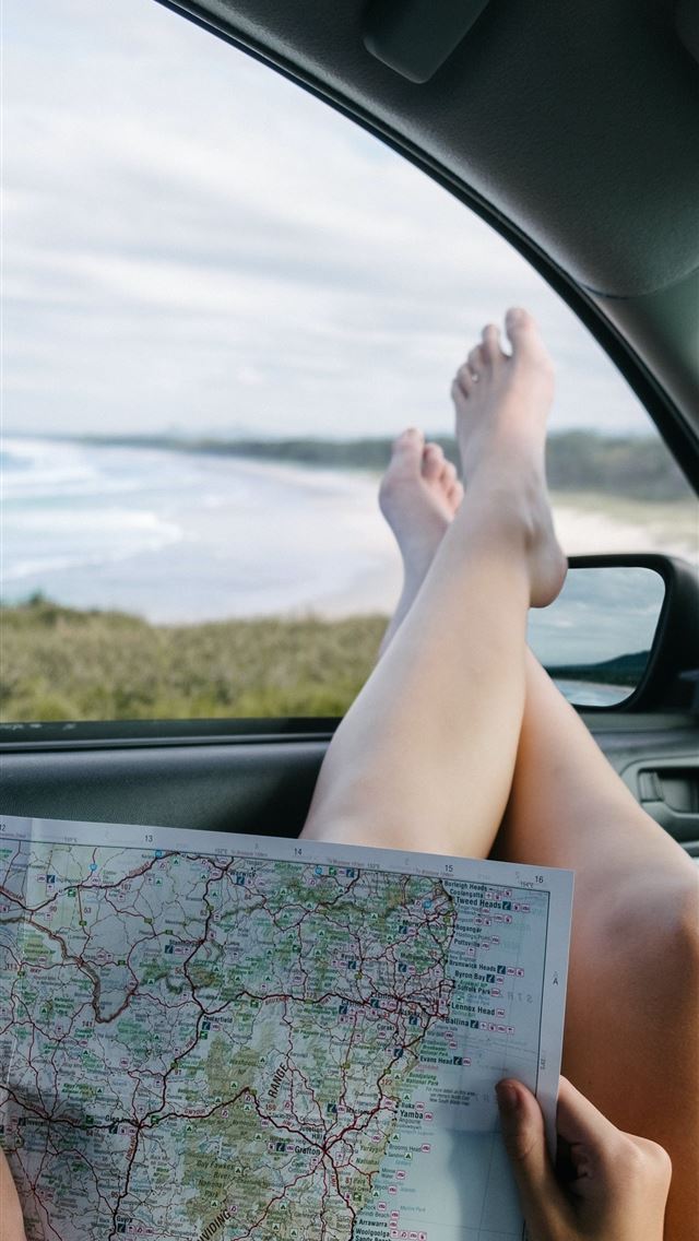 1284x2778 woman holding map - gold coast iPhone Wallpaper