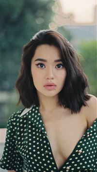 woman wearing black and white V neck top wallpaper