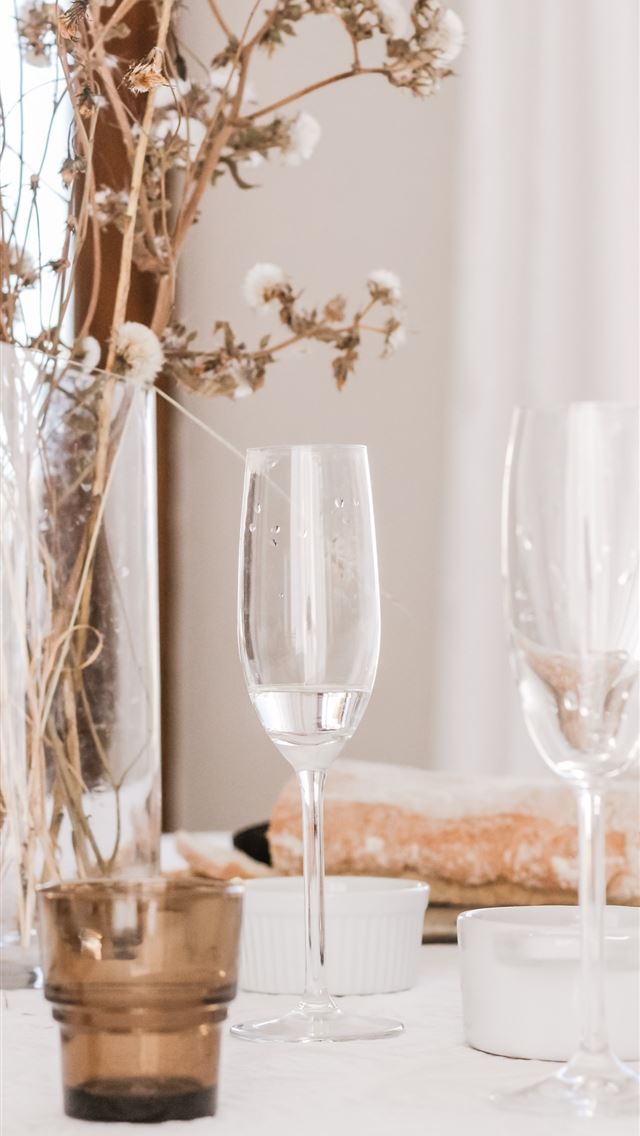 1284x2778 champagne glasses beside flower centerpiece - love iPhone Wallpaper