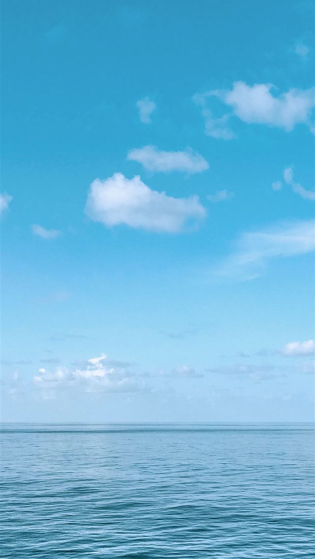 1284x2778 blue body of water under blue and white sky during... -  iphone 13 Wallpaper