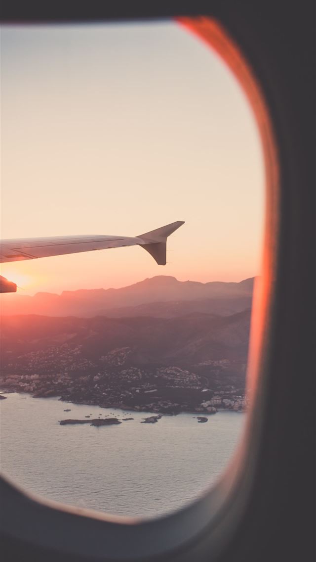 1284x2778 person riding airplane photography - spain iPhone Wallpaper