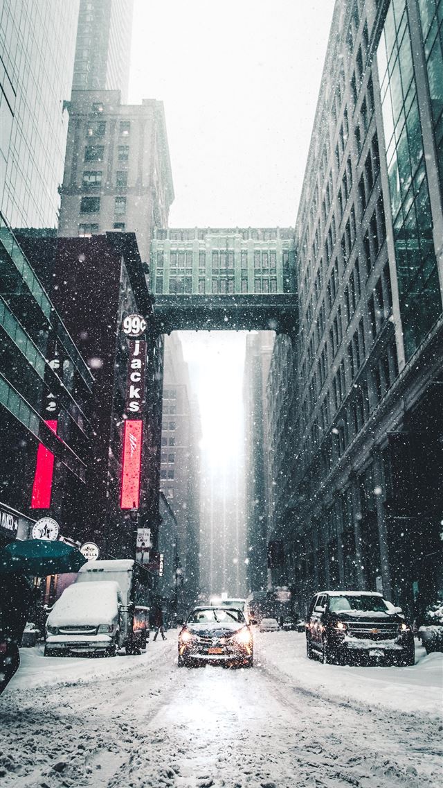 1284x2778 person walking on the street during day time - winter iPhone Wallpaper