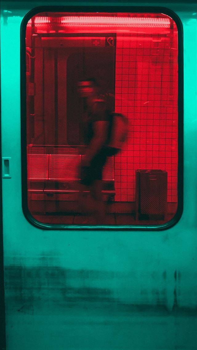 1284x2778 person inside train - teal iPhone Wallpaper