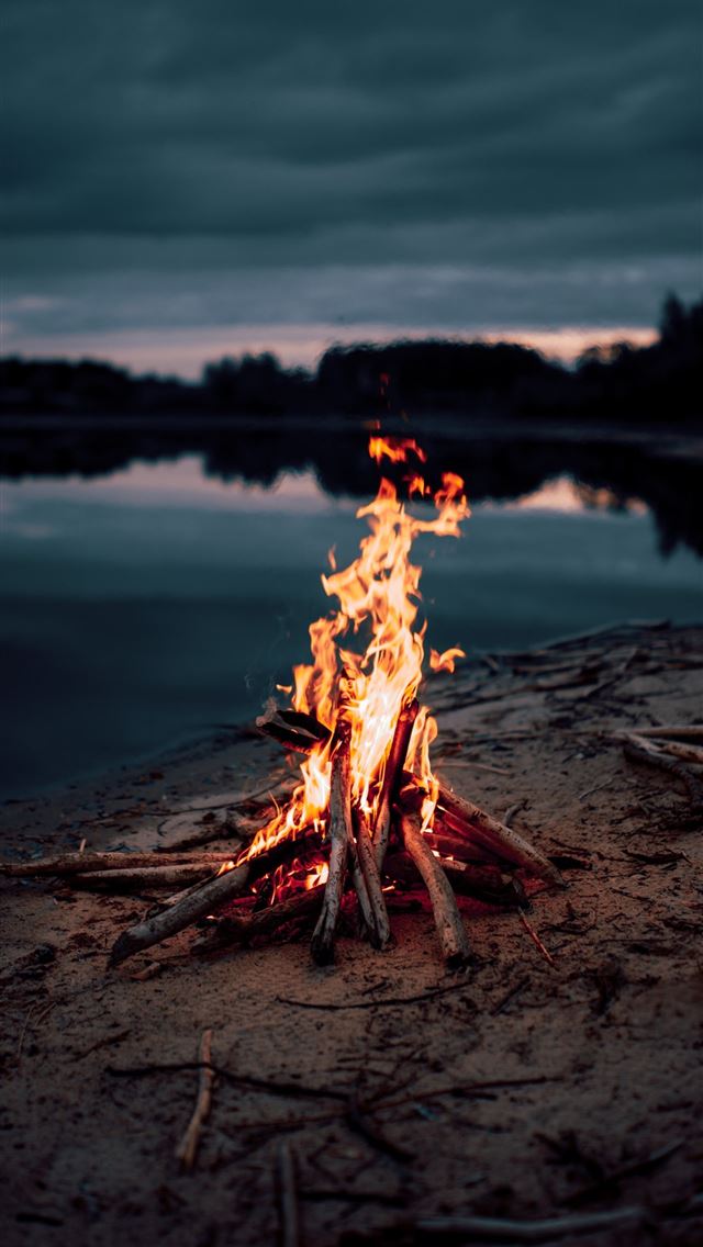 1284x2778 bonfire near body of water during night time - fire iPhone Wallpaper