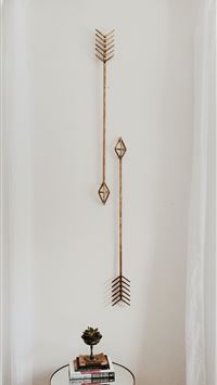 brown wooden cross on white wall wallpaper