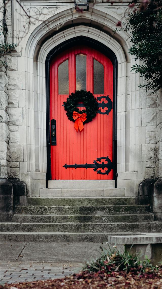 1284x2778 close up photo of red wooden door - holiday iPhone Wallpaper