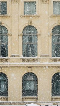 photo of beige concrete 3 storey building with sno... wallpaper