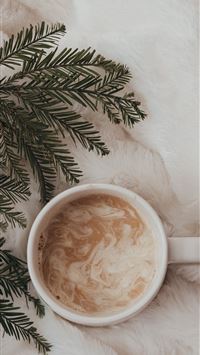 cup of coffee latte on fur textile wallpaper