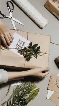 brown box beside leaves scissors and yarn wallpaper