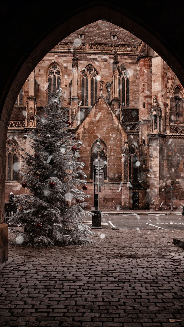 1284x2778 brown concrete building - christmas iPhone Wallpaper