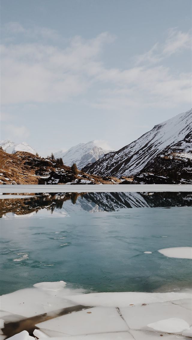 1284x2778 body of water beside mountain covered with snow - mountain iPhone Wallpaper