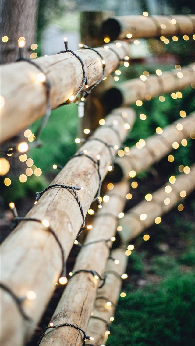 1284x2778 brown bamboo fence with string lights - lights iPhone Wallpaper