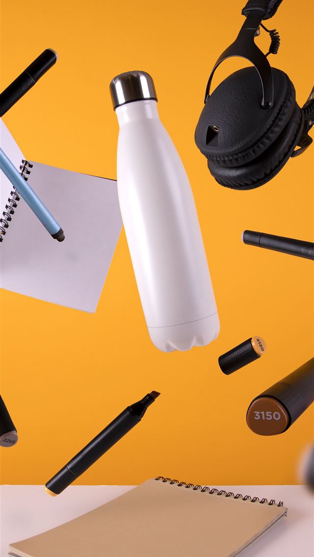 1284x2778 black cordless headphones beside sport bottle and ... - portugal iPhone Wallpaper