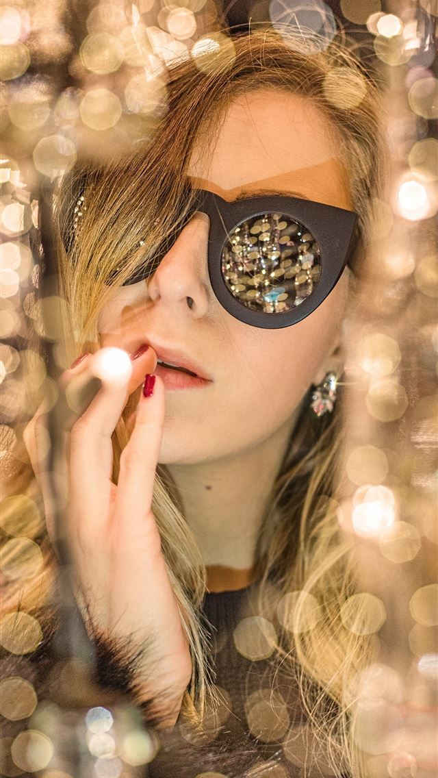 1284x2778 woman holding lips with black framed sunglasses - netherlands iPhone Wallpaper