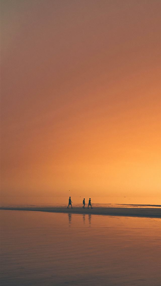 1284x2778 silhoutte of three person on beach - yellow iPhone Wallpaper