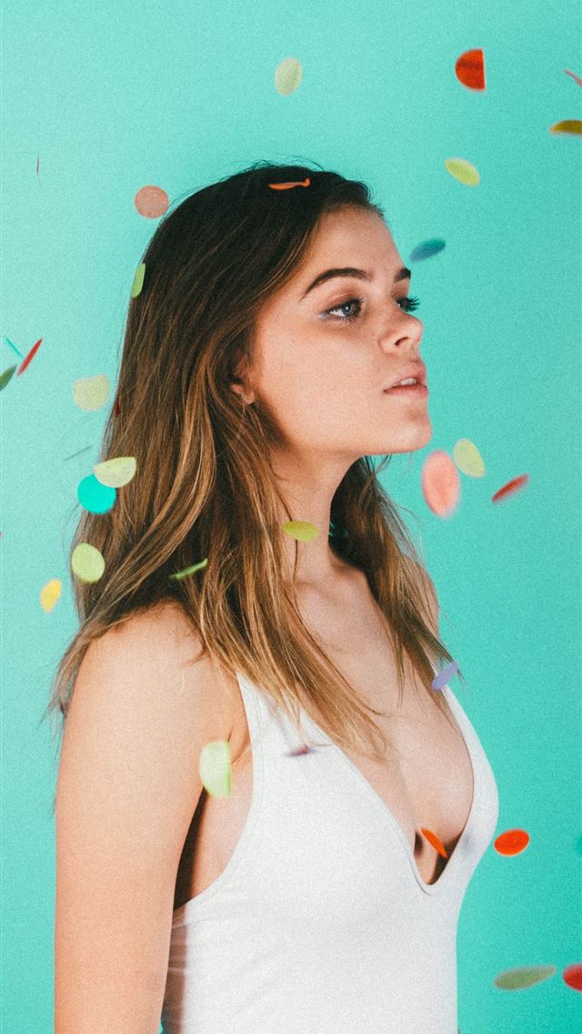 1284x2778 woman standing surrounded with confetti - girl iPhone Wallpaper