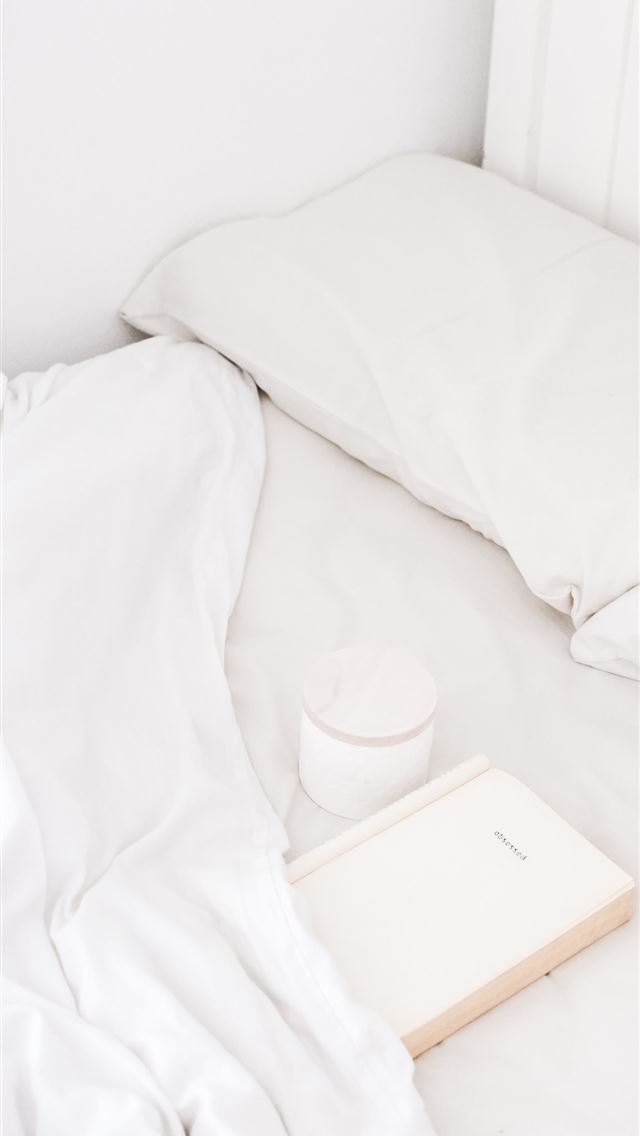 1284x2778 white portable speaker on bed - design iPhone Wallpaper