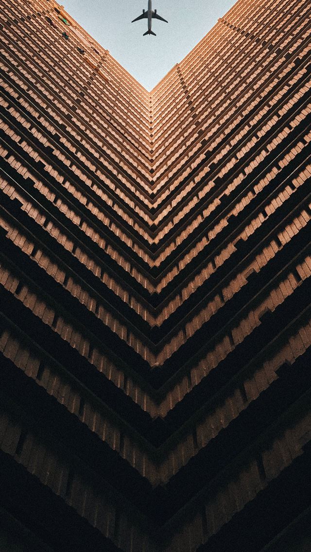 1284x2778 worm view photo of brown building during daytime - travel iPhone Wallpaper