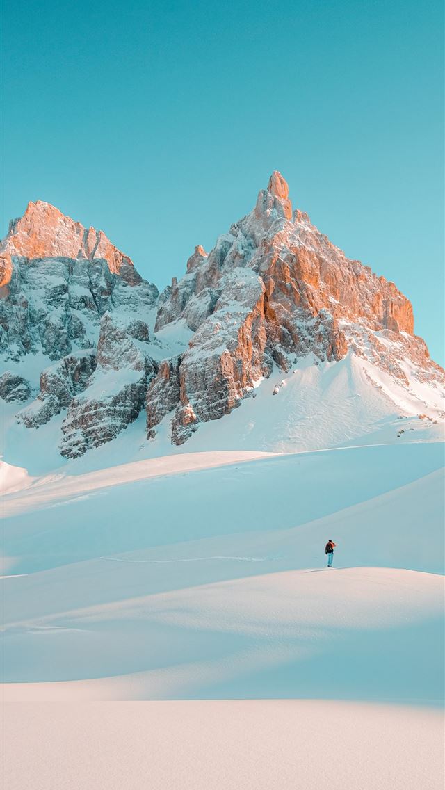 1284x2778 person walking on snow covered mountain during day... - tn iPhone Wallpaper