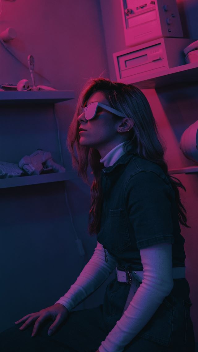 1284x2778 woman sitting on stool inside dim room - neon iPhone Wallpaper