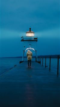 person walking on dock wallpaper