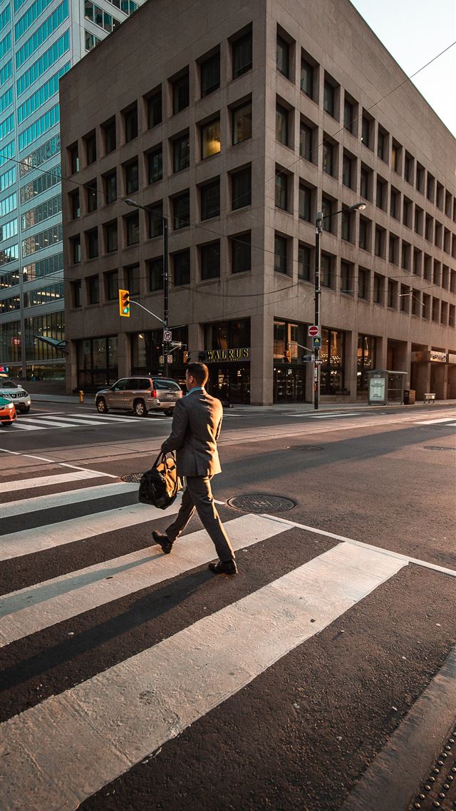 1284x2778 man crossing pedestrian lane -  iPhone Wallpaper