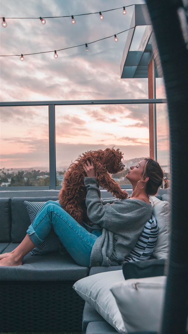 1284x2778 woman holding dog while sitting on sofa -  iPhone Wallpaper