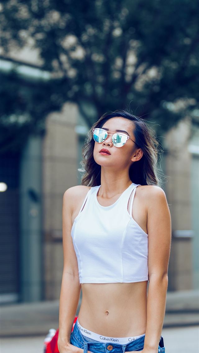 1284x2778 woman wearing blue denim jeans and white sleeved l... -  iphone 13 Wallpaper
