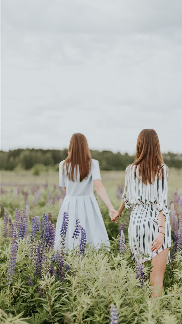1284x2778 two women surrounded by lavender under nimbus clou... - latvia iPhone Wallpaper
