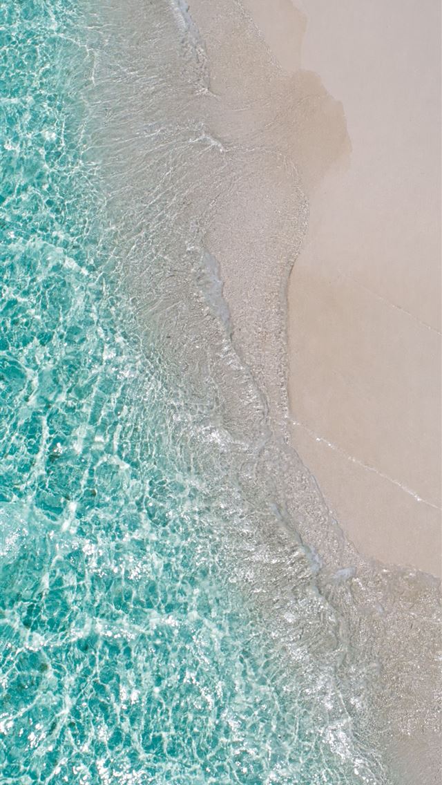 1284x2778 woman lying on brown sand during daytime -  iphone 13 Wallpaper