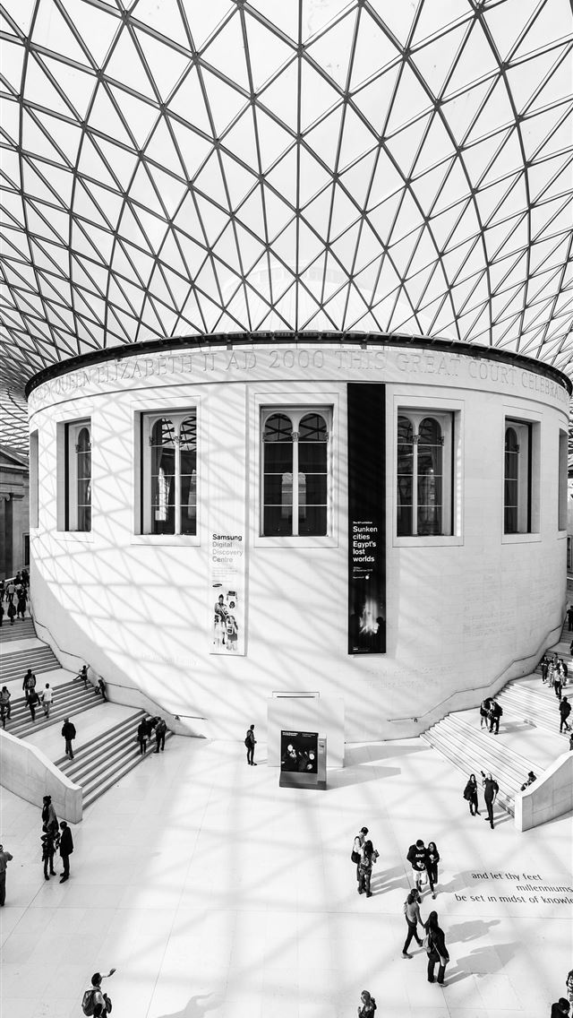 1284x2778 grayscale photography of people inside building - united kingdom iPhone Wallpaper