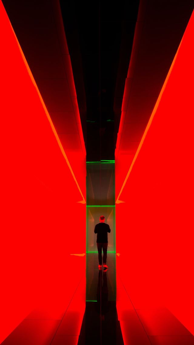 1284x2778 man between red light hallway -  iPhone Wallpaper