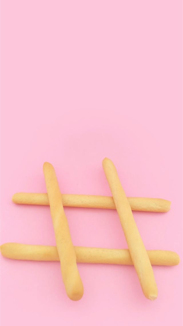 1284x2778 four brown wooden sticks on pink surface - pink iPhone Wallpaper