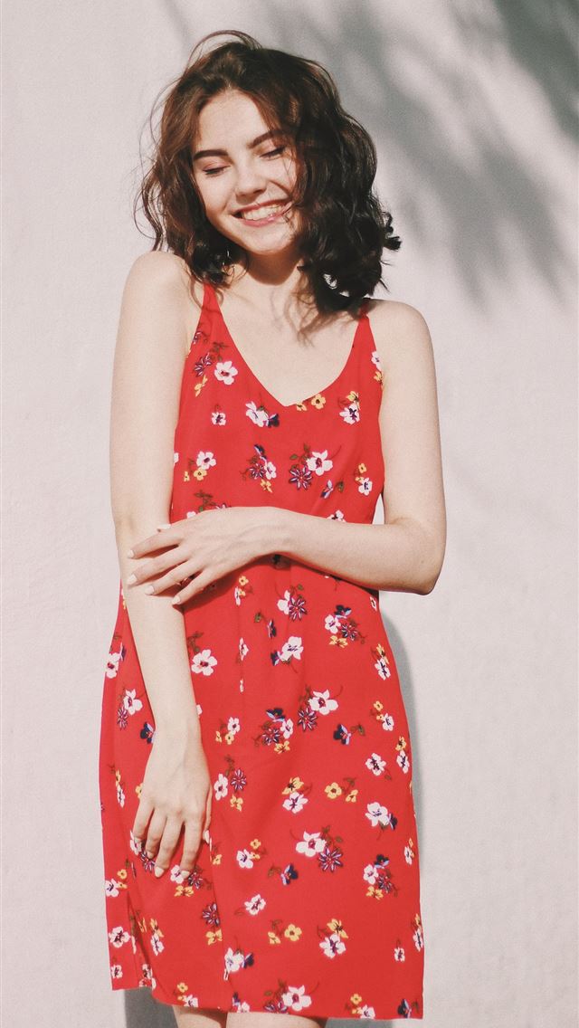 1284x2778 woman standing in front of white wall - kyiv iPhone Wallpaper