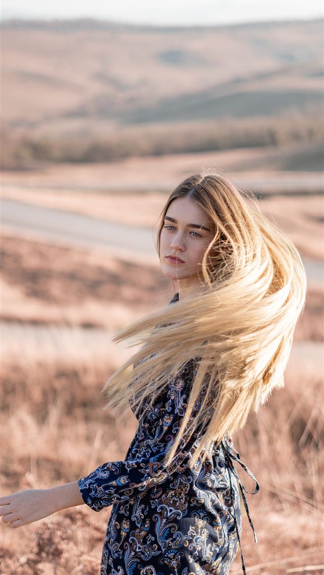 1284x2778 woman standing in brown field - girl iPhone Wallpaper