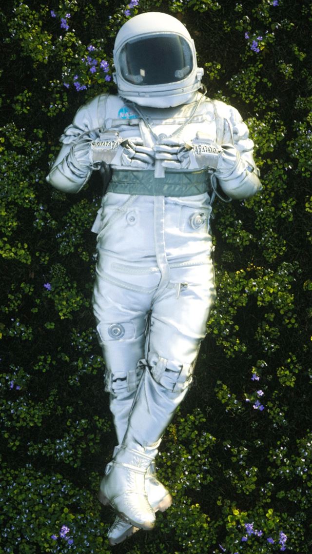 1284x2778 man in white helmet and white pants standing on gr... - space iPhone Wallpaper