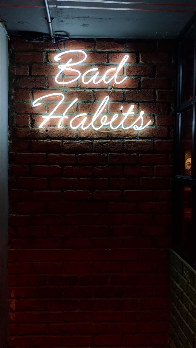 1284x2778 white bad habits LED signage - window iPhone Wallpaper