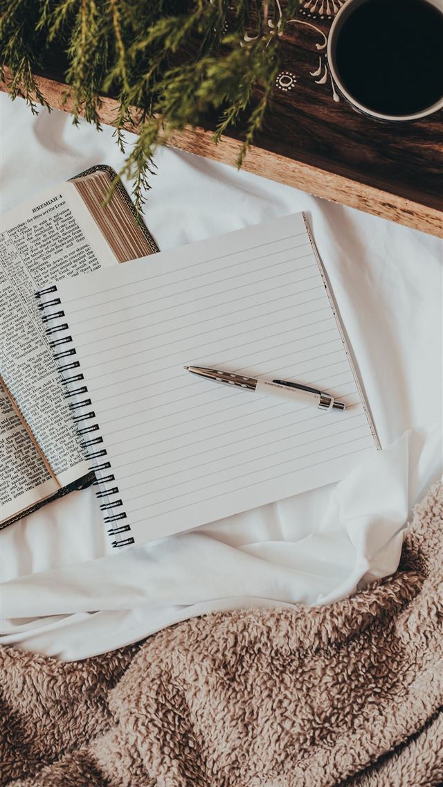 1284x2778 white notebook on white textile - bible iPhone Wallpaper