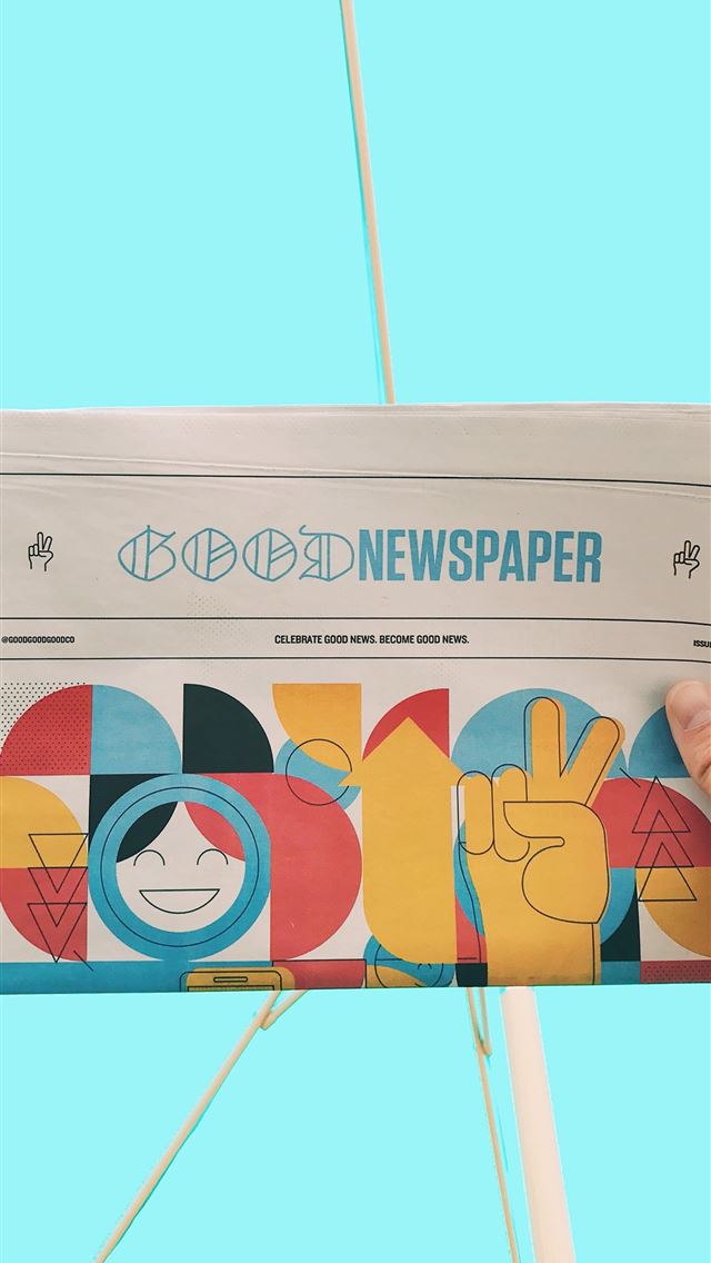 1284x2778 person holding newspaper article - portland iPhone Wallpaper